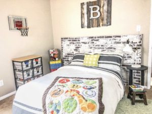 faux exposed brick as a headboard around bed