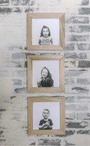 diy wood frames on brick wall