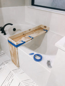 DIY process of making a rustic bathtub tray