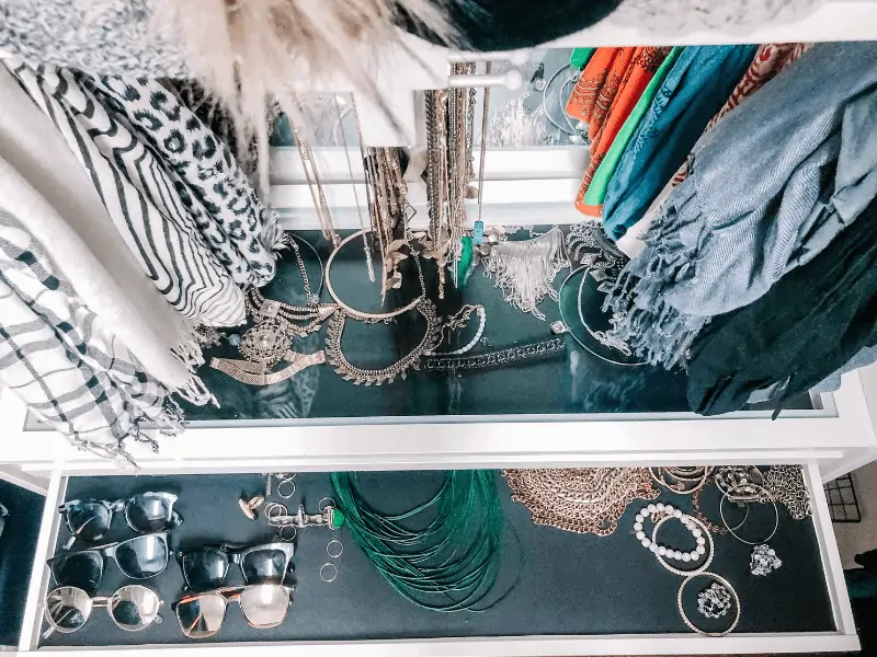 jewelry organization in closet with simple necklaces hung on a tie butler & statement necklaces and sunglasses in ikea komplement pull out trays