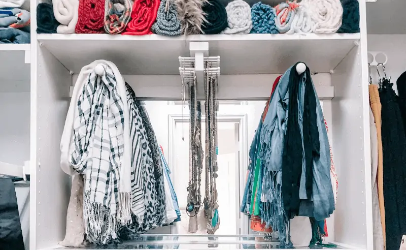 scarves beautifully displayed on scarf hanger in closet