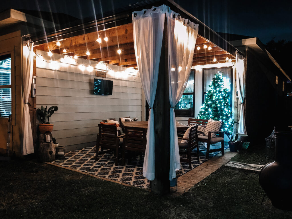 Christmas tree in front of window on patio