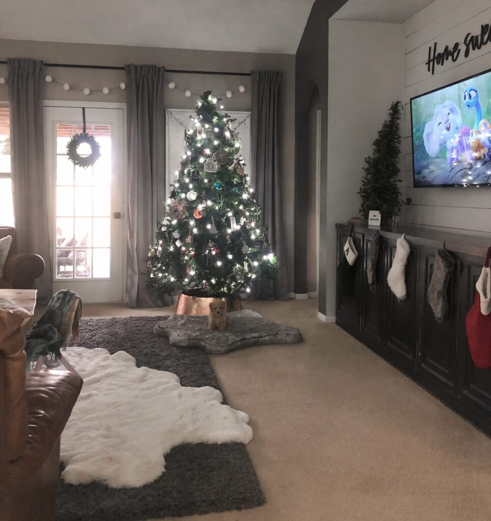 cozy living room with christmas tree and christmas stockings